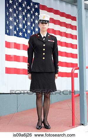 Servicewoman in dress blues by US flag View Large Photo Image Stock Photograph - Servicewoman in dress blues by US flag. Fotosearch