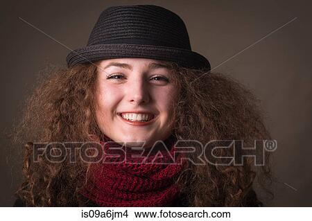 Picture - Smiling woman wearing hat and scarf. Fotosearch
