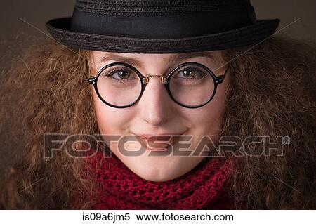 Smiling woman wearing hat and scarf View Large Photo Image Stock Photography - Smiling woman wearing hat and scarf. Fotosearch