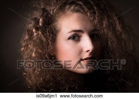 Smiling woman with curly hair View Large Photo Image Stock Image - Smiling woman with curly hair. Fotosearch