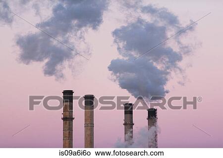 Picture - Smoke billowing from industrial plant. Fotosearch