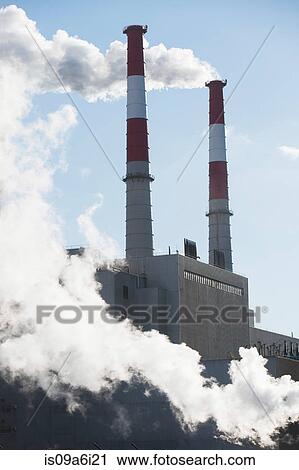 Smoke billowing from industrial plant View Large Photo Image Stock Image - Smoke billowing from industrial plant. Fotosearch