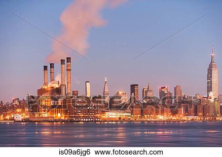 Stock Photograph - Smoke billowing from industrial plant. Fotosearch