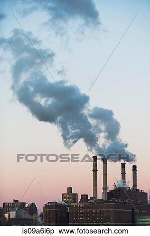 Stock Photography - Smoke billowing from industrial plant. Fotosearch