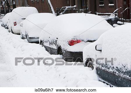Snow covered cars on city street View Large Photo Image Stock Photo - Snow covered cars on city street. Fotosearch