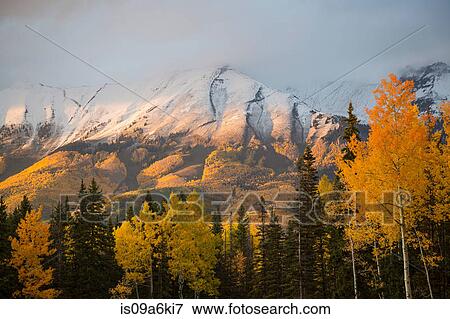 Stock Photo - Snowy hilltops in rural landscape. Fotosearch
