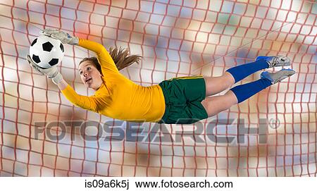 Soccer player catching ball in air View Large Photo Image Stock Image - Soccer player catching ball in air. Fotosearch