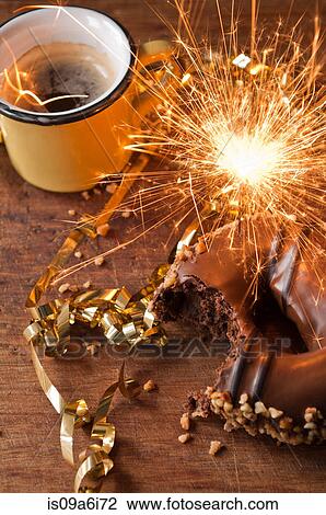 Sparkler, doughnut and cup of coffee View Large Photo Image Stock Image - Sparkler, doughnut and cup of coffee. Fotosearch