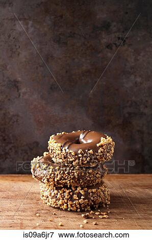 Stack of decorated doughnuts View Large Photo Image Stock Photo - Stack of decorated doughnuts. Fotosearch