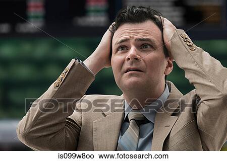 Stressed businessman at stock exchange View Large Photo Image Picture - Stressed businessman at stock exchange. Fotosearch