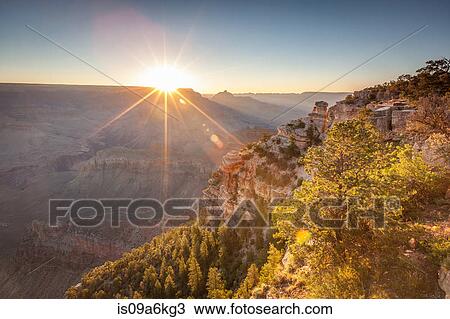 Sun rising over rural mountains View Large Photo Image Stock Image - Sun rising over rural mountains. Fotosearch