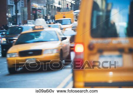 Taxis sitting in city traffic View Large Photo Image Stock Photo - Taxis sitting in city traffic. Fotosearch