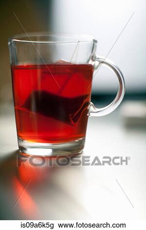 Tea bag steeping in glass mug View Large Photo Image Stock Image - Tea bag steeping in glass mug. Fotosearch