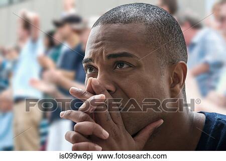 Tense man at sports game View Large Photo Image Stock Image - Tense man at sports game. Fotosearch