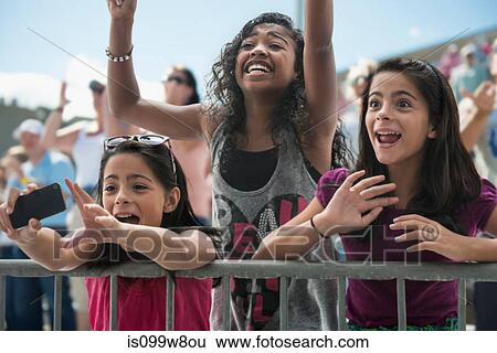 Three excited girls at a pop concert View Large Photo Image Stock Photograph - Three excited girls at a pop concert. Fotosearch