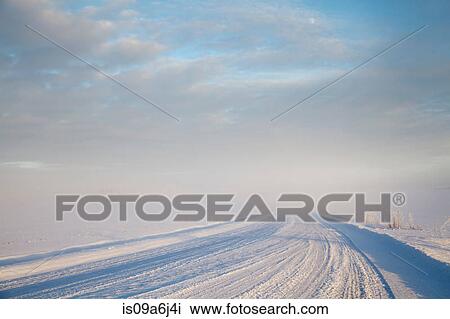 Tire tracks in snowy rural road View Large Photo Image Stock Image - Tire tracks in snowy rural road. Fotosearch