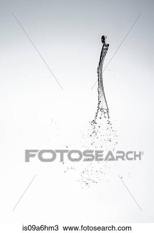 Stock Image - Water splashing in air. Fotosearch