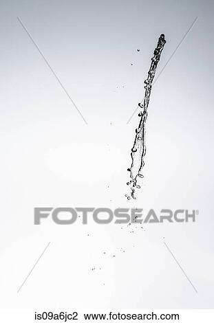 Stock Image - Water splashing in air. Fotosearch