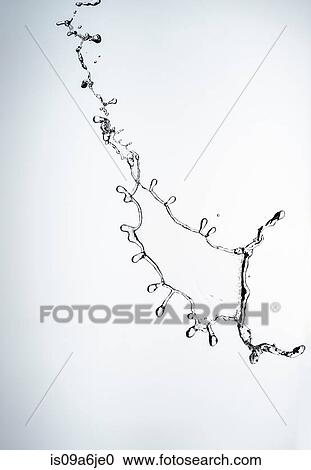 Stock Image - Water splashing in air. Fotosearch