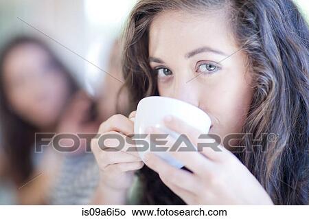Picture - Woman drinking cup of coffee. Fotosearch