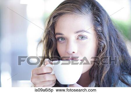 Stock Photography - Woman drinking cup of coffee. Fotosearch