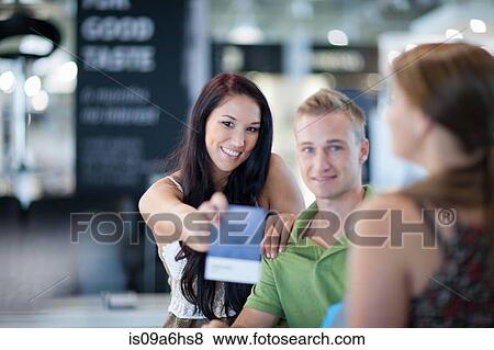Woman holding fabric swatch in store View Large Photo Image Stock Photo - Woman holding fabric swatch in store. Fotosearch