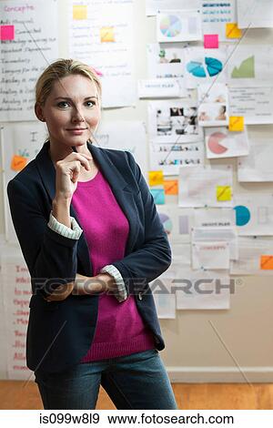 Stock Photo - Woman holding pen. Fotosearch