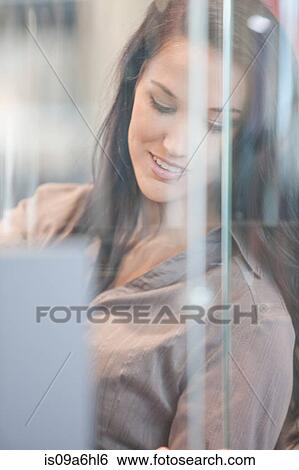 Woman looking in glass case View Large Photo Image Stock Photograph - Woman looking in glass case. Fotosearch