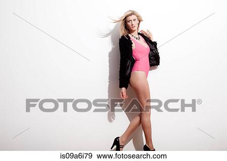 Stock Photo - Woman modeling swimsuit and jacket. Fotosearch