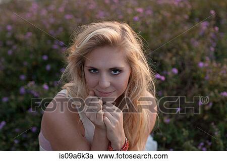 Woman sitting in purple flowers View Large Photo Image Stock Image - Woman sitting in purple flowers. Fotosearch