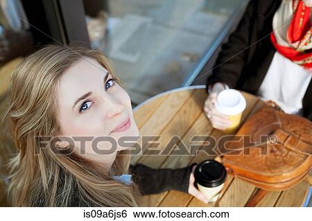 Woman smiling at sidewalk cafe View Large Photo Image Stock Photograph - Woman smiling at sidewalk cafe. Fotosearch