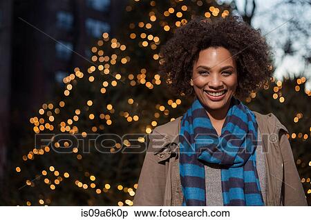 Woman smiling on city street View Large Photo Image Stock Photography - Woman smiling on city street. Fotosearch
