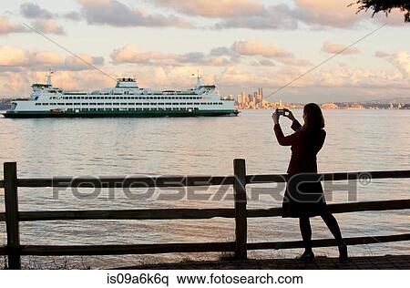 Woman taking picture of cruise ship View Large Photo Image Stock Photography - Woman taking picture of cruise ship. Fotosearch