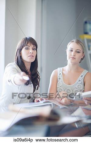 Woman talking with interior decorator View Large Photo Image Stock Photography - Woman talking with interior decorator. Fotosearch