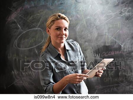 Woman using digital tablet View Large Photo Image Picture - Woman using digital tablet. Fotosearch