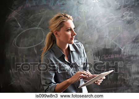 Woman using digital tablet View Large Photo Image Stock Image - Woman using digital tablet. Fotosearch