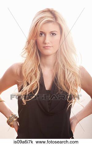 Stock Image - Woman wearing black top. Fotosearch