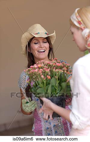 Women gardening together View Large Photo Image Stock Photograph - Women gardening together. Fotosearch