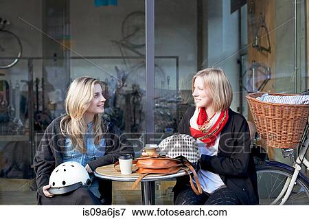 Women having coffee together outdoors View Large Photo Image Stock Photo - Women having coffee together outdoors. Fotosearch