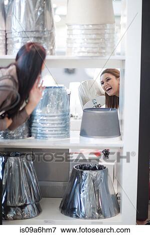 Women shopping for lamps in store View Large Photo Image Stock Photo - Women shopping for lamps in store. Fotosearch