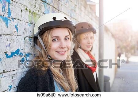 Women wearing bicycle helmets View Large Photo Image Stock Image - Women wearing bicycle helmets. Fotosearch