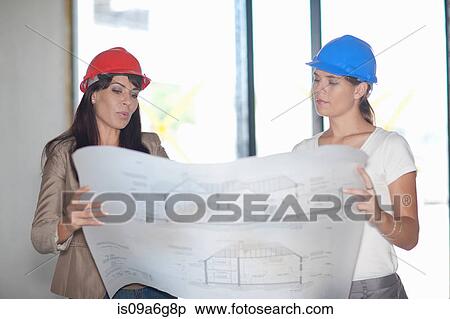 Architect and project manager looking at blueprint View Large Photo Image Stock Photography - Architect and project manager looking at blueprint. Fotosearch