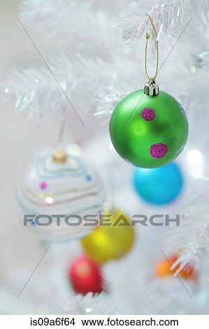 Picture - Baubles on christmas tree. Fotosearch