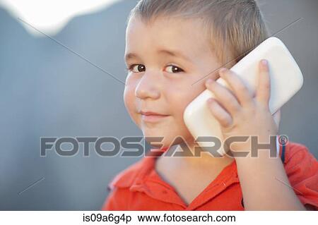 Boy using smartphone View Large Photo Image Stock Photography - Boy using smartphone. Fotosearch