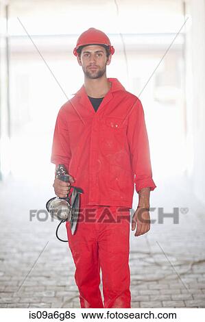 Stock Photograph - Building contractor with circular saw. Fotosearch