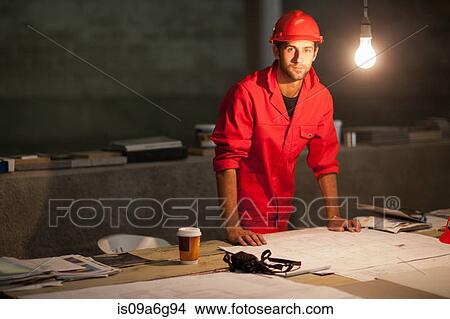Building contractor working late on site View Large Photo Image Picture - Building contractor working late on site. Fotosearch