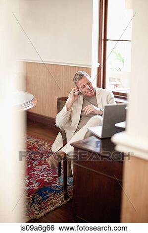 Businessman on cell phone View Large Photo Image Stock Photograph - Businessman on cell phone. Fotosearch