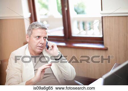 Businessman on cell phone View Large Photo Image Stock Photography - Businessman on cell phone. Fotosearch