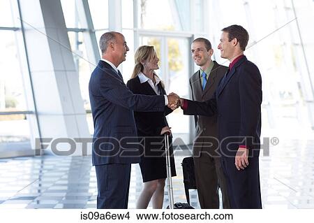Picture - Businesspeople shaking hands. Fotosearch