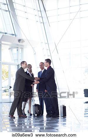 Stock Image - Businesspeople shaking hands. Fotosearch